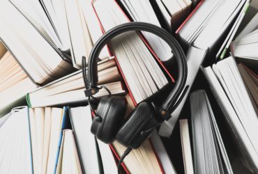 COMPheadphones-on-many-books-background-top-view-2025-03-26-18-04-44-utc-min COMPheadphones-on-many-books-background-top-view-2025-03-26-18-04-44-utc-min